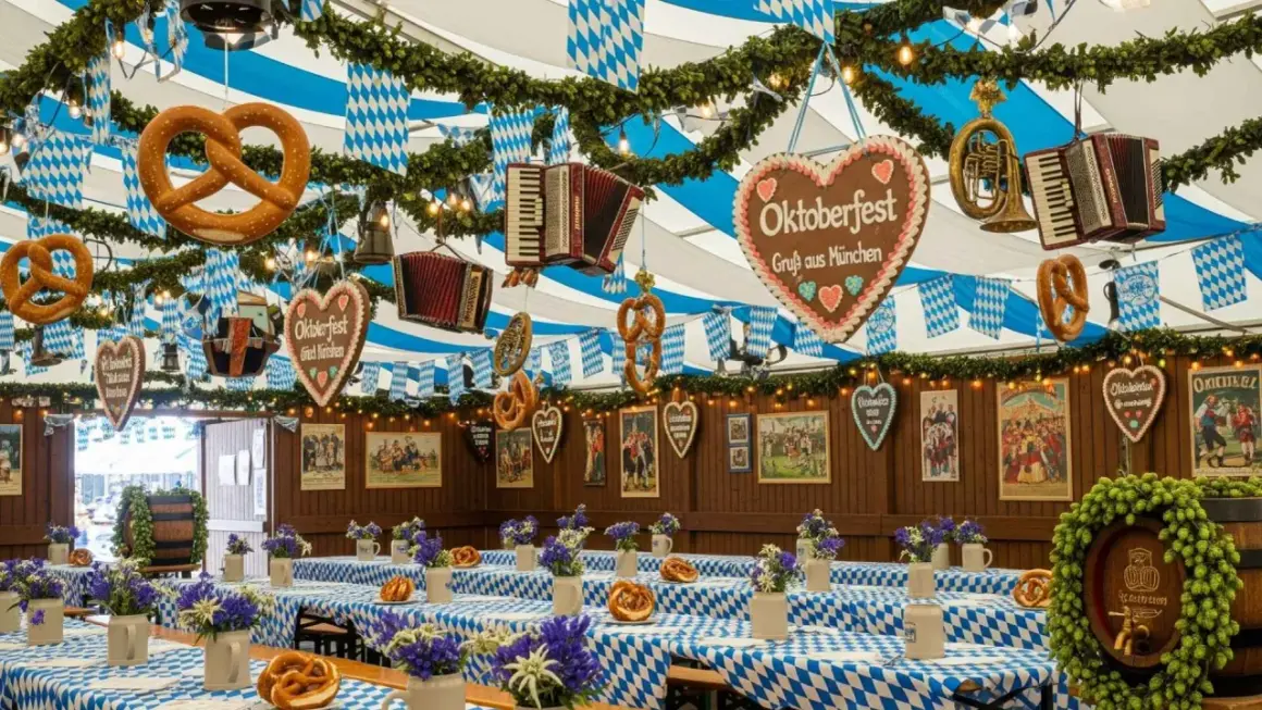 Wystrój namiotu z preclami, akordeonami i sercem z napisem "Oktoberfest" sugeruje, że to właśnie tutaj jest Oktoberfest.